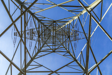 electric pylons transporting electricity through high tension ca