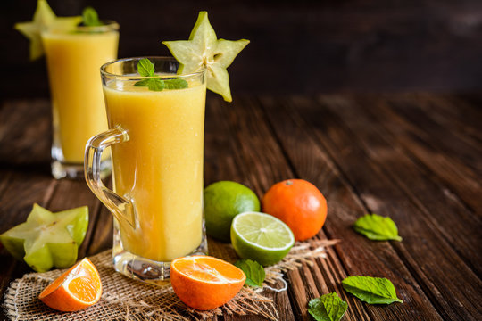 Mandarin Smoothie With Carambola And Lime In A Glass Jar