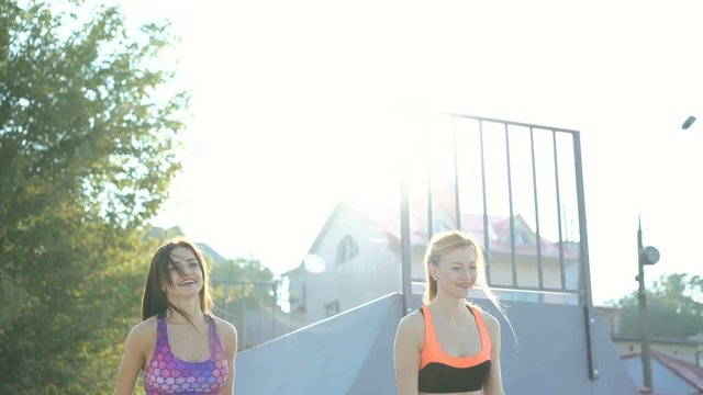 Two girl on the street fitness. 4K
