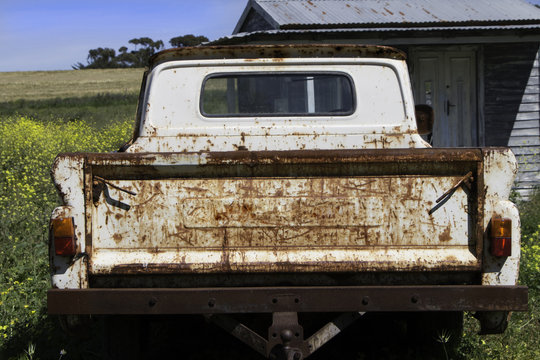 Abandoned and rusted old  truck on farm. Old truck background. Rusty old pickup truck.