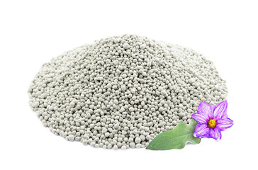 Heap of composite mineral fertilizers with leaf and flower, isol