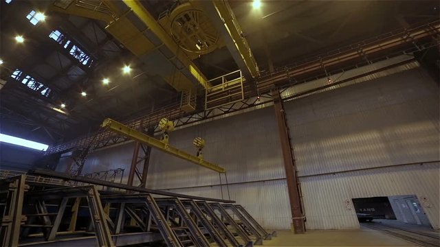 Steel Plant. Crane Transports Metal Beam. Wide Panorama
