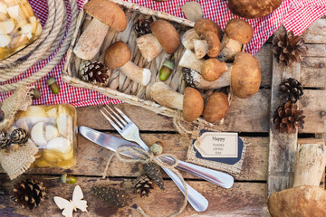 Raw white mushrooms, pine cones and tag for simple text