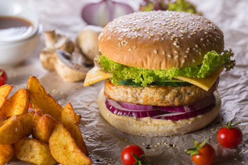 burger with grilled turkey, cheese and tomato