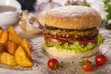 burger with grilled beef, sauces and tomato