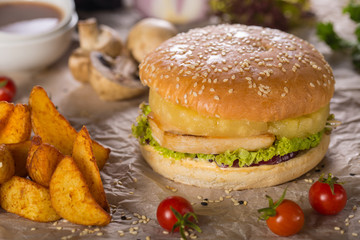 burger with grilled chiken, pineapple and salad leaf