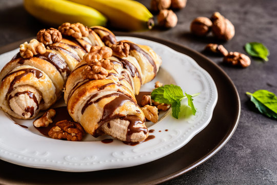 Baked Banana Coated In Puff Pastry, Topped With Chocolate And Walnuts