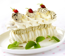 meringue cake with fresh berries on white background