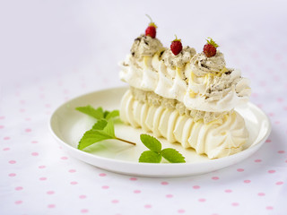 meringue cake with fresh berries on white background