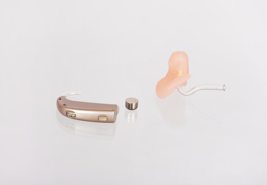 Hearing aids, ear mould and a battery with their reflections