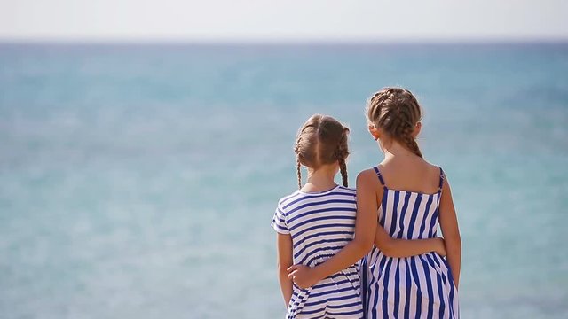 Adorable little girls together during beach vacation