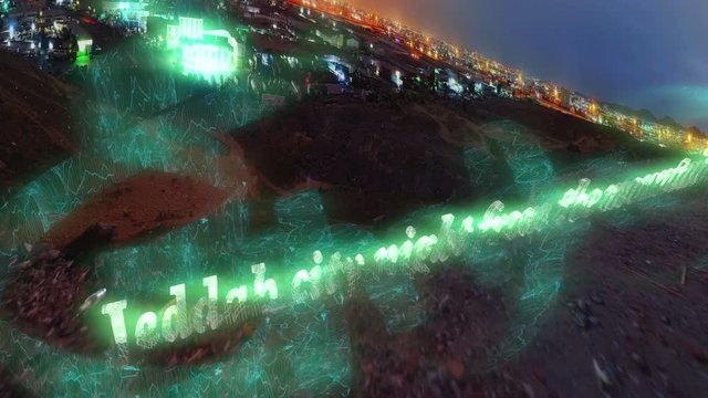 Jeddah city Neon Text from the top of the mountain at night