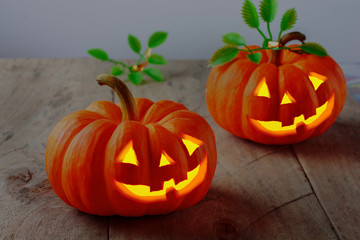 Jack o' lantern, halloween, pumpkins on wooden background