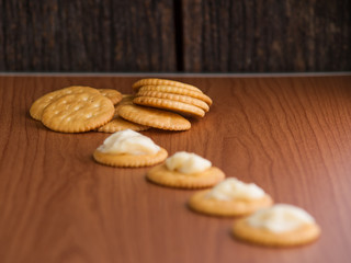 crackers biscuits on wooden background