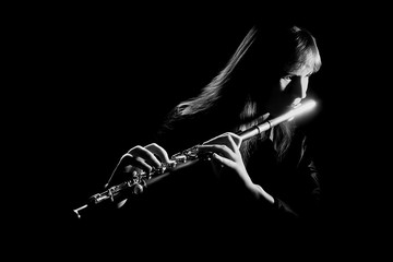 Flutist playing flute music instrument  © Alenavlad