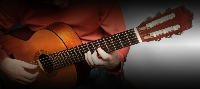 Acoustic guitar hands close up
