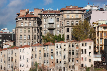 Fototapeta na wymiar View of old houses and tiled roofs of Istanbul in the Beyoglu district. Next to the famous Taksim Square.