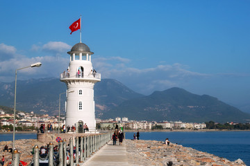 Fototapeta na wymiar Lighthouse in the harbor of Alanya. Turkey.