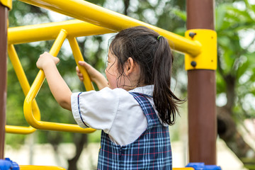 Fototapeta premium Child Hanging Bar at Playground
