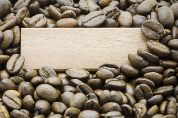 A blank board in middle of coffee beans