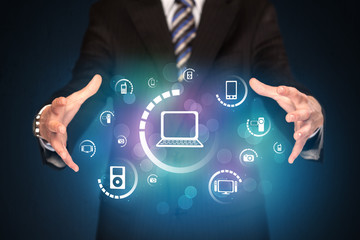 holding digital media icons