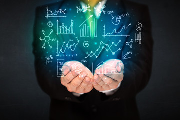 holding hand drawn business diagrams