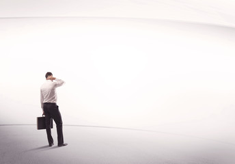 Businessman with briefcase standing still
