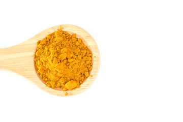 Turmeric powder in wood spoon on white background