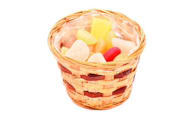 Fototapeta na wymiar Wood basket with jellies isolated on white