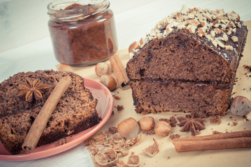 Vintage photo, Gingerbread or dark cake with chocolate, cocoa and plum jam, delicious dessert