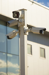Fototapeta na wymiar A post full of surveillance cameras