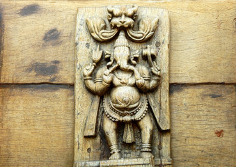 Fototapeta na wymiar Wooden carving of Hindu God Ganesha 