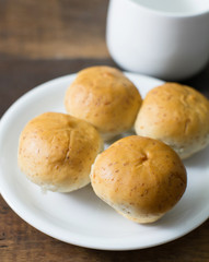 mushroom bread on white dish and coffee cup