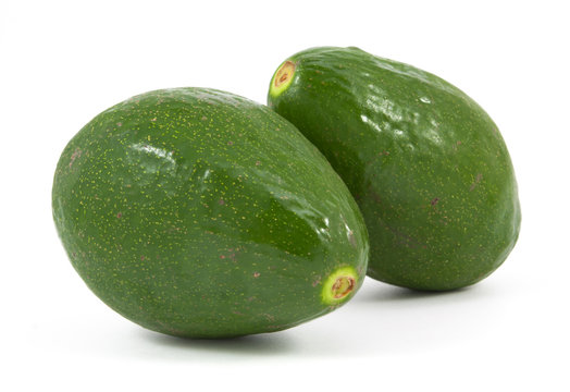 two ripe avocados isolated
