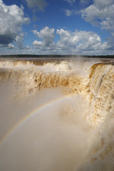 Enormous amounts of water thundering down the devil's throat at Iguazu waterfall, Argentina