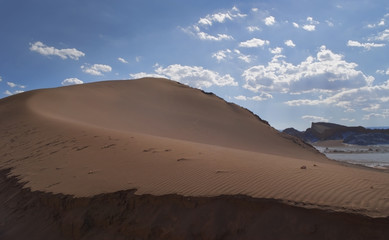 Fototapeta na wymiar Sand dune in the desert sun