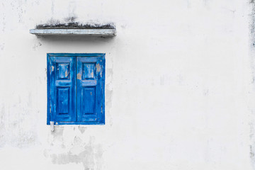 blue color windows on white wall with space for text.