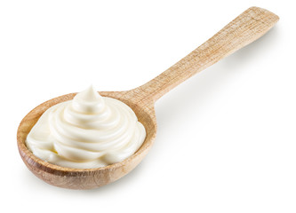 Mayonnaise swirl in the wooden spoon. File contains clipping pat