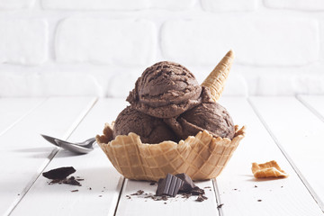 Chocolate ice cream bowl and chocolate pieces. - 121624545