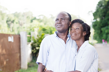 travel, leisure, young couple embracing looking at something in the trees.