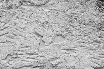 Wall fragment with scratches and cracks