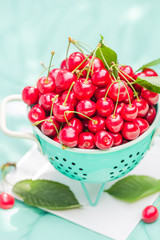fresh red cherry fruit green colander