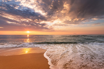 Brilliant ocean beach sunrise.