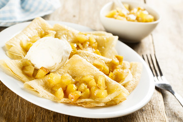 Pancakes with apple sauce and ice cream