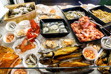 Fresh seafood displayed on ice in a local restaurant at Southwold Harbour, UK