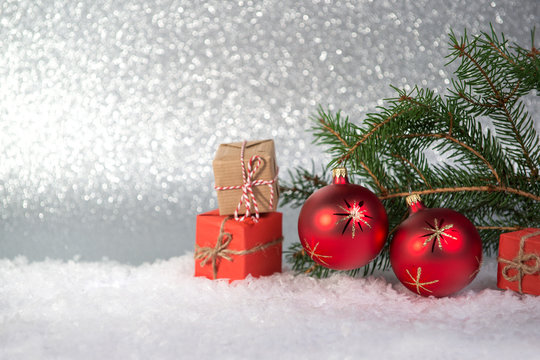 Christmas background with fir, red balls and gifts