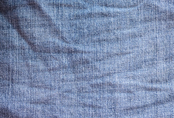 синяя джинсовая ткань. линялые старые синие джинсы  