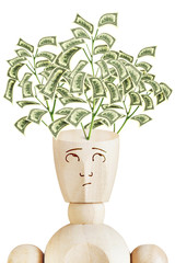 Money tree growing from human head. Psychology of wealth. Abstract image with a wooden puppet