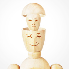 Split personality. Psychological problems. Abstract image with a wooden puppet