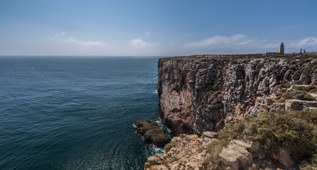 Fototapeta na wymiar Rocks and Lighthouse at Fortaleza De Sagres
